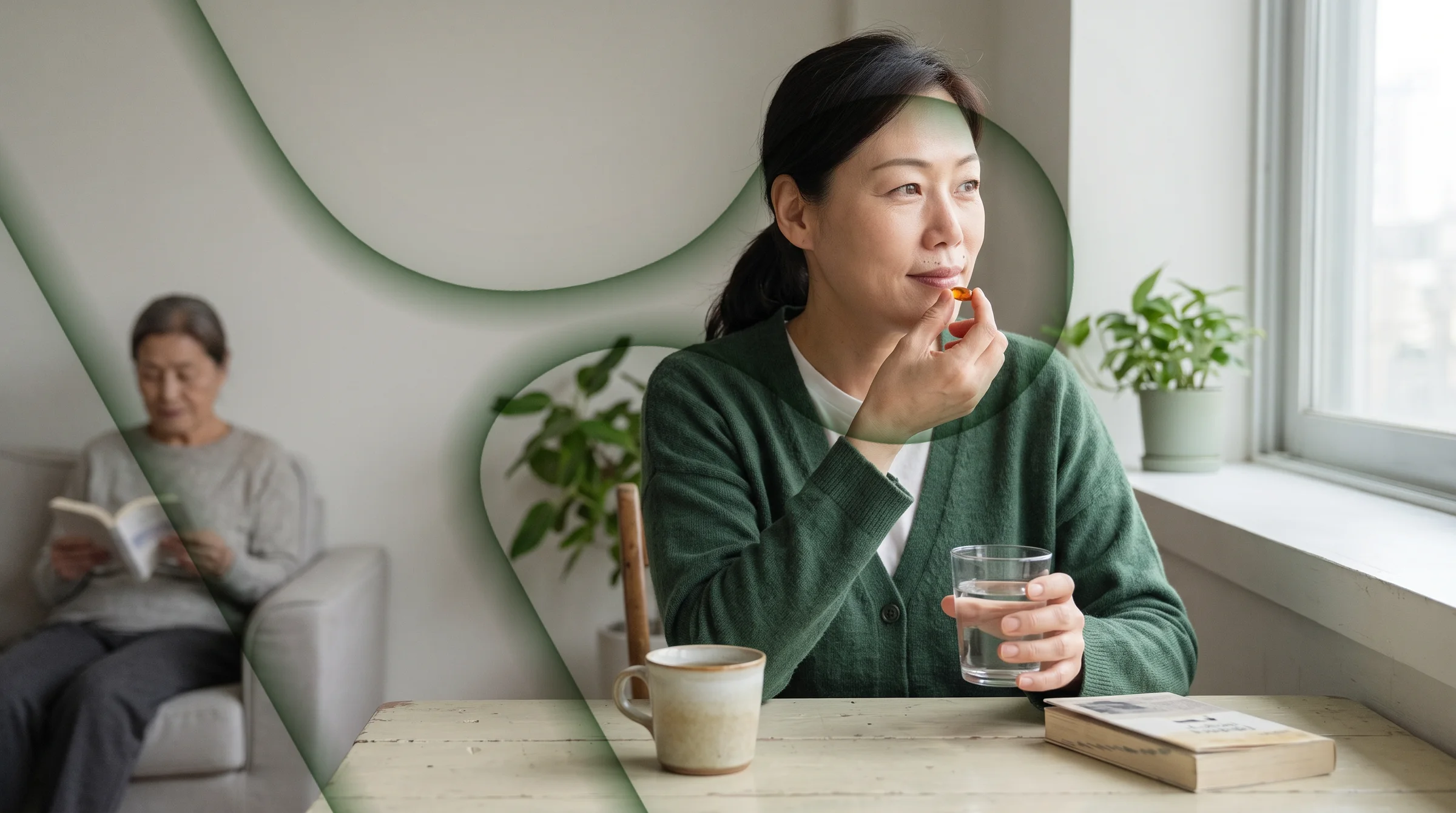 The daughter at the table by the window, taking a softgel with water
