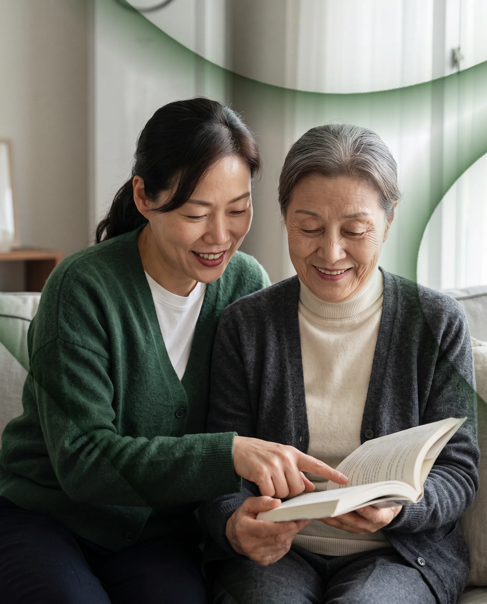 A woman and her elderly mother reading a book together on the sofa